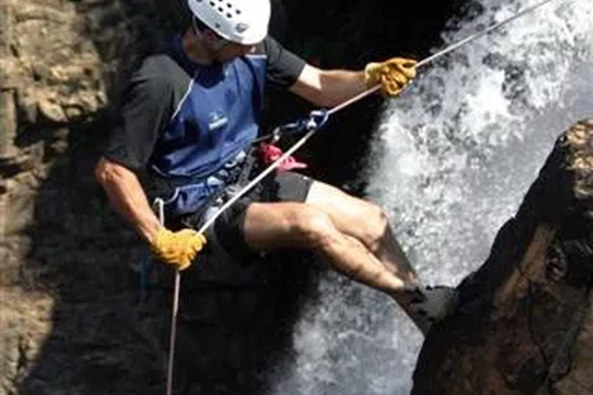 Male tourist abseiling on a water fall with Magoebaskloof Adventures in Tzaneen