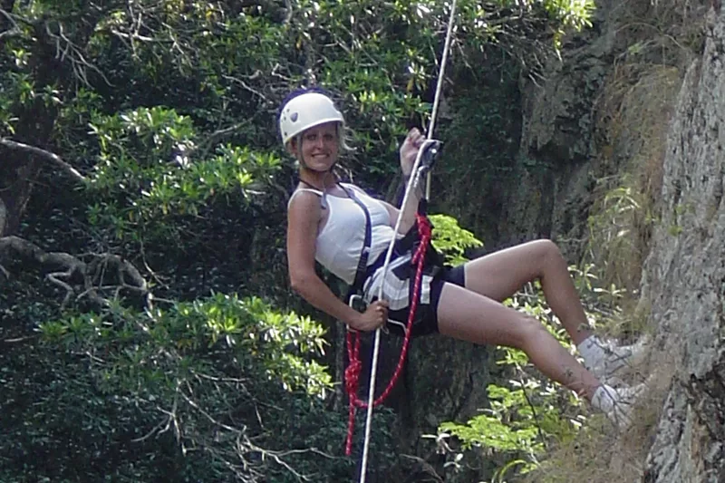 Female tourist abseiling with Magoebaskloof Adventures in Tzaneen