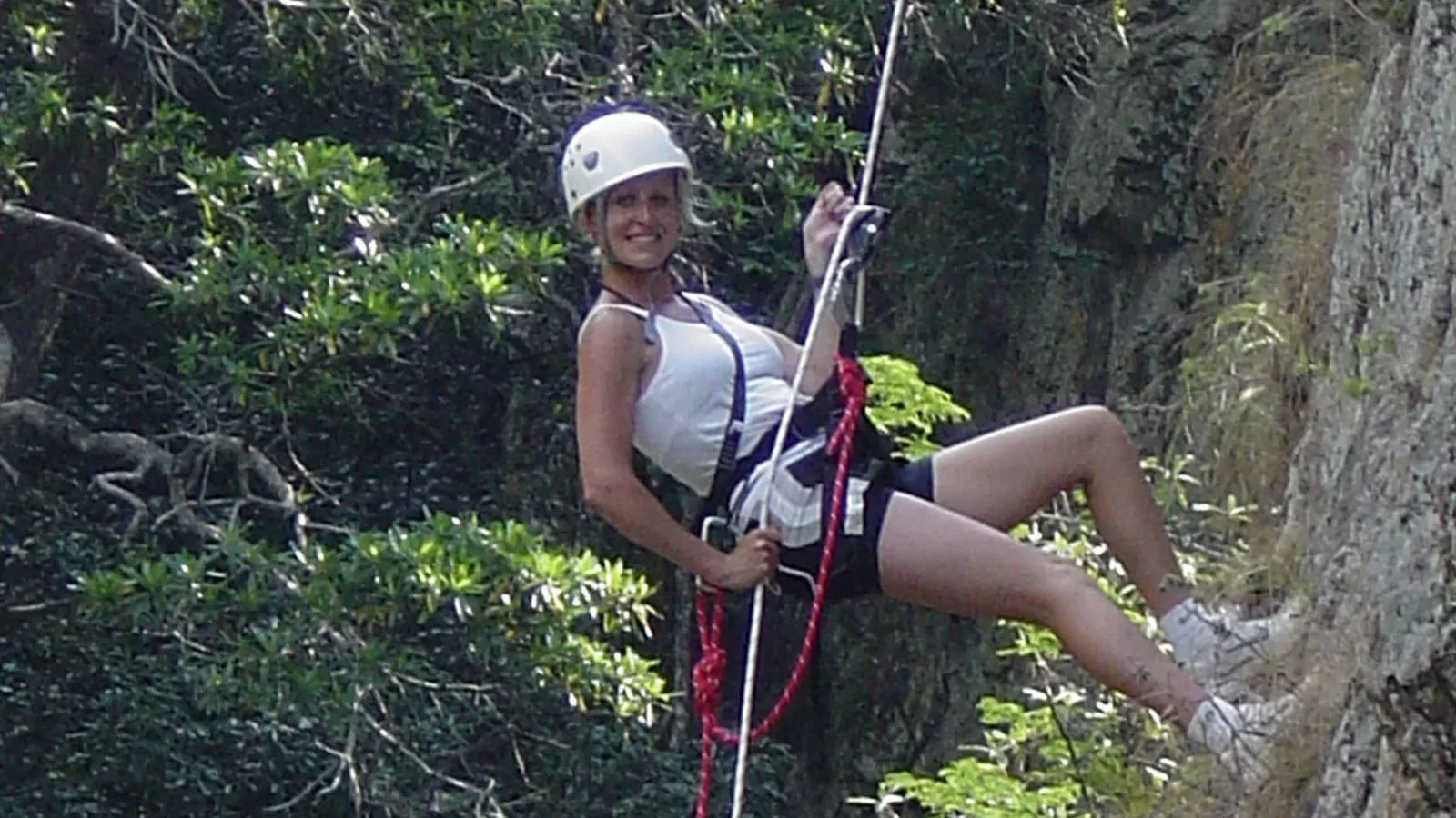 Female tourist abseiling with Magoebaskloof Adventures in Tzaneen