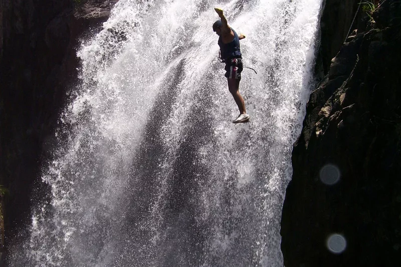 Tourist jumping into a river kloofing with Magoebaskloof Adventures in Tzaneen