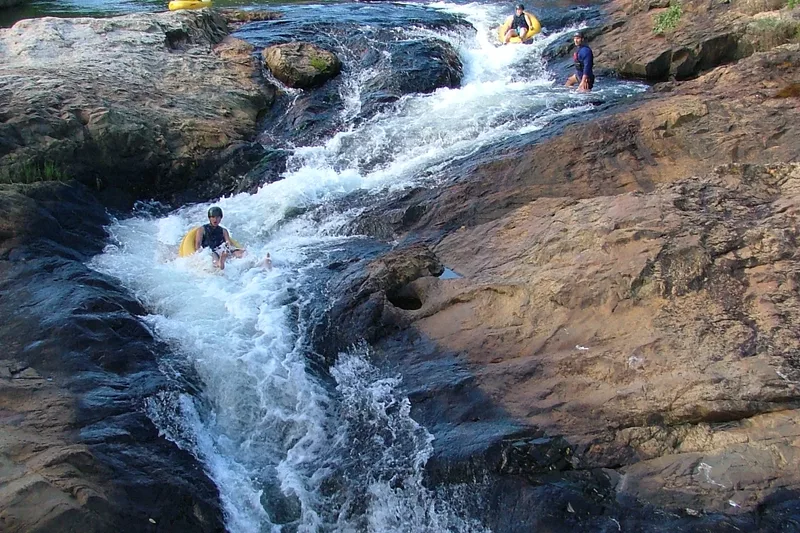 Group of tourists gecko tubing in a river with Magoebaskloof Adventures alternate view 2