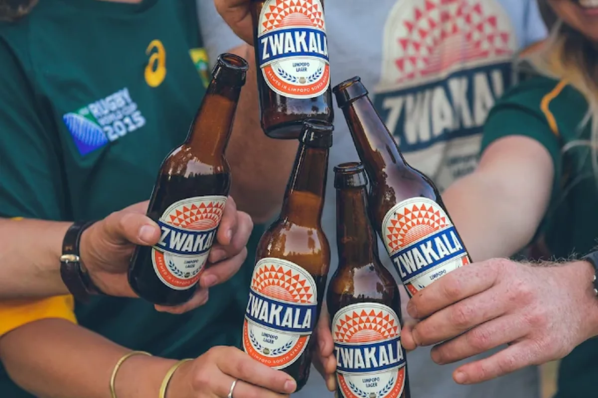 Friends holding zwakala beers in Magoebaskloof