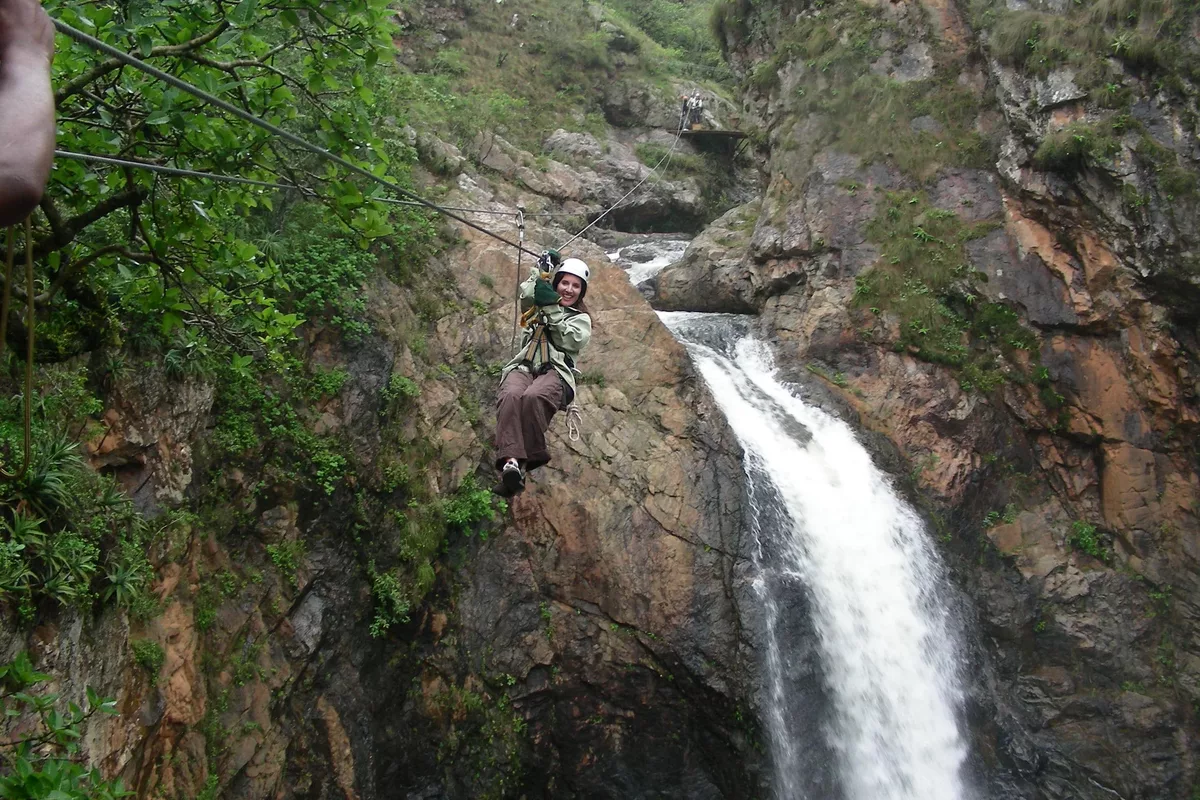 Female tourists zip lining Magoebaskloof canopy tours in Tzaneen