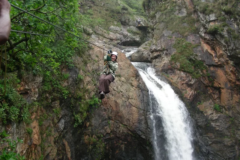 Female tourists zip lining Magoebaskloof canopy tours in Tzaneen