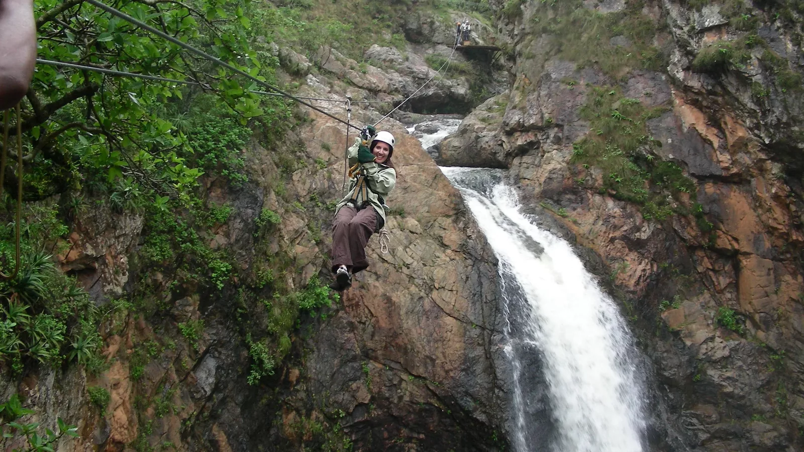 Female tourists zip lining Magoebaskloof canopy tours in Tzaneen