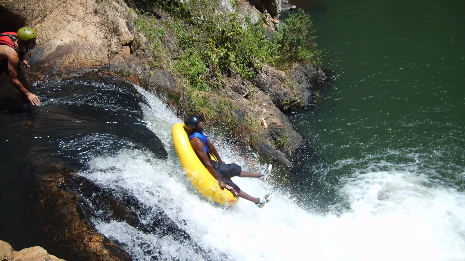 Tourists gecko tubing in a river with Magoebaskloof Adventures
